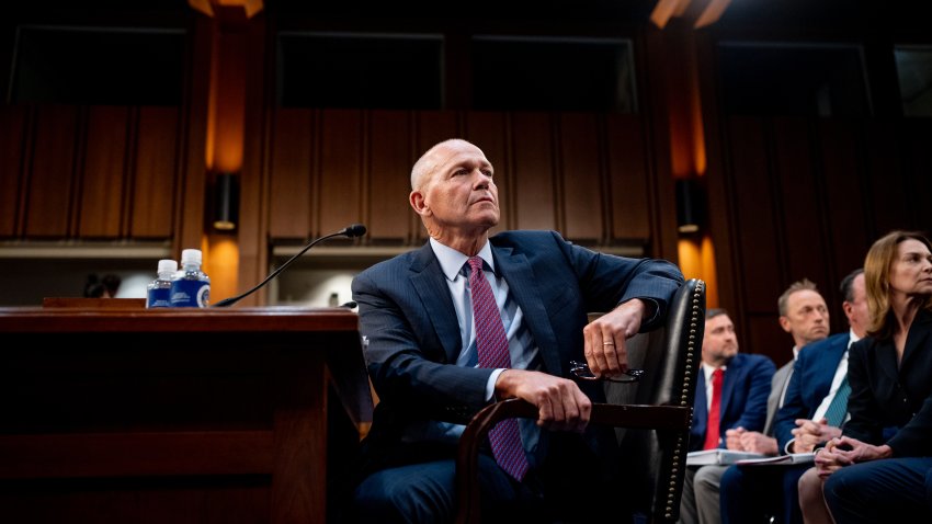 Boeing CEO Dave Calhoun turns behind him during a Senate Homeland Security and Governmental Affairs Investigations Subcommittee hearing on Boeing's broken safety culture on Capitol Hill on June 18, 2024 in Washington, DC.