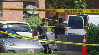 North Las Vegas Police investigate the scene where five people were found dead in an apartment complex in North Las Vegas, Tuesday, June 25, 2024.