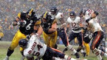 PITTSBURGH - DECEMBER 11:  Jerome Bettis #36 of the Pittsburgh Steelers runs over Brian Urlacher #54 the Chicago Bears for a touchdown on December 11, 2005 at Heinz Field in Pittsburgh, Pennsylvania. The Steelers defeated the Bears 21-9.  (Photo by Ezra Shaw/Getty Images)