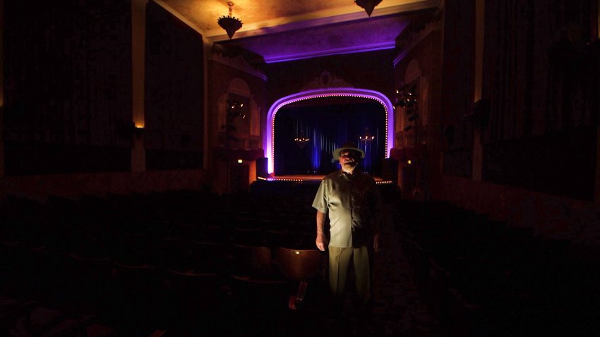 Roger Rhoten, who has worked at the Sebastiani Theater for 38 years, stands in its main theater.