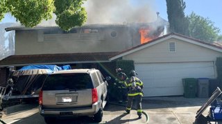 Fire crews battle a blaze at a home in San Jose. (June 12, 2024)
