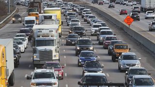 A truck on Rte 93 in Canton, MA rolled over and the contents were spilled across the highway, causing a rare pandemic sight of a long traffic jam on the highway on Dec. 7, 2020.