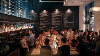 A steady crowd keeps Ardesia, a wine bar near the theater district in Midtown Manhattan, busy late into the night on Friday evening, in New York, New York.