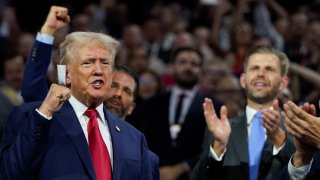 Republican presidential nominee and former U.S. President Donald Trump raises his fist during Day 1 of the Republican National Convention (RNC) at the Fiserv Forum in Milwaukee, Wisconsin, U.S., July 15, 2024.