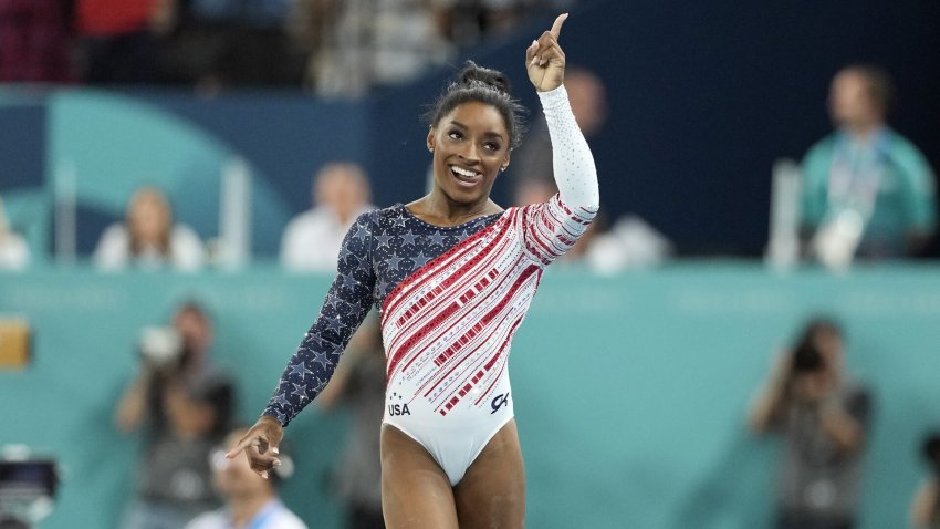 Simone Biles celebrates after her floor routine at the Paris Olympic Games