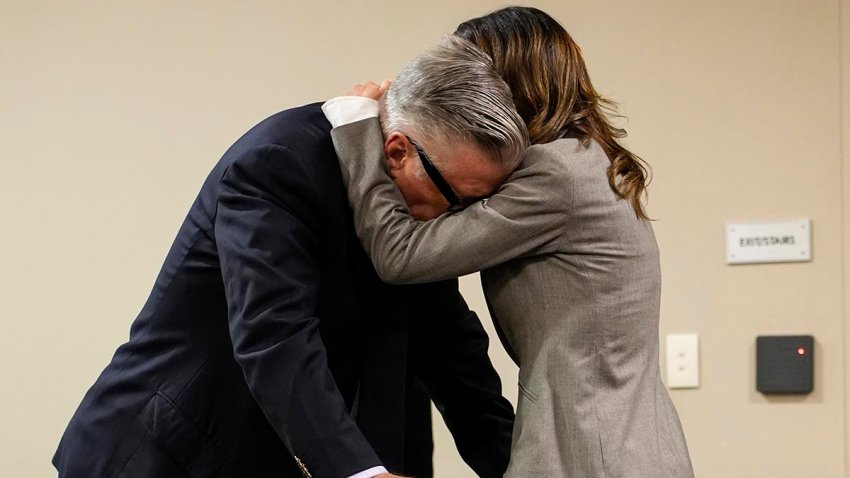 Hilaria Baldwin, right, speaks to her husband, actor Alec Baldwin, during his trial for involuntary manslaughter for the 2021 fatal shooting of cinematographer Halyna Hutchins during filming of the Western movie "Rust," Friday, July 12, 2024, at Santa Fe County District Court in Santa Fe, N.M.