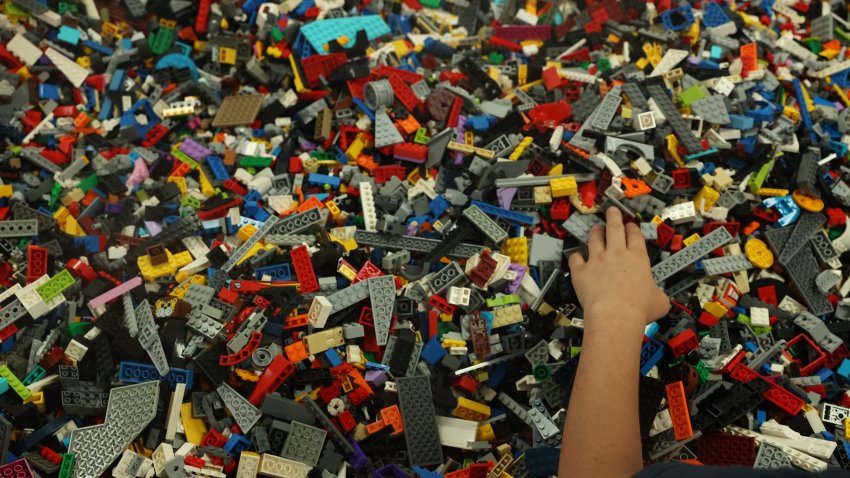 Whittier, CA – June 13: Zane Leuschner, 9, looks through lego figures at Bricks & Minifigs on Thursday, June 13, 2024 in Whittier, CA. (Michael Blackshire / Los Angeles Times via Getty Images)