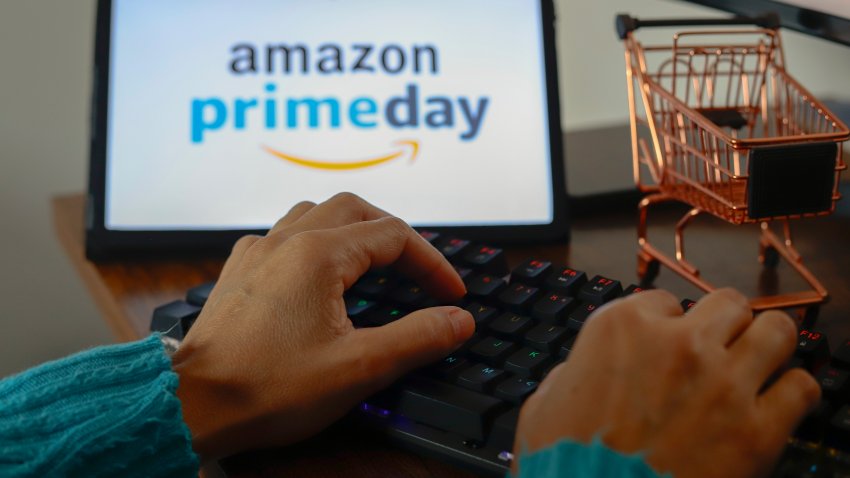 PARAGUAY – 2024/07/12: In this photo illustration, a person types near the Amazon Prime Day logo displayed on the screen of a tablet.