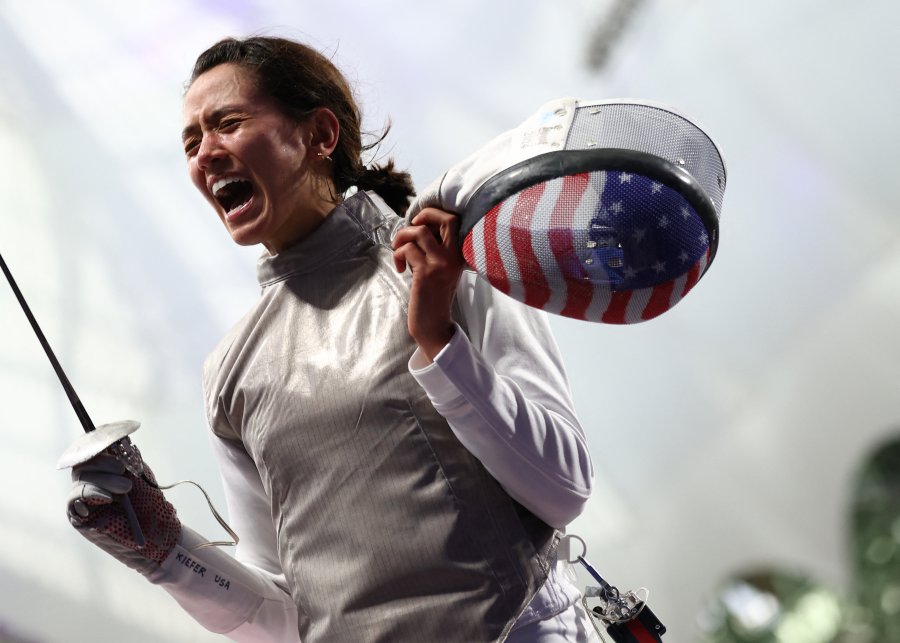 US' Lee Kiefer celebrates after winning against China's Huang Qianqian in the women's foil individual round