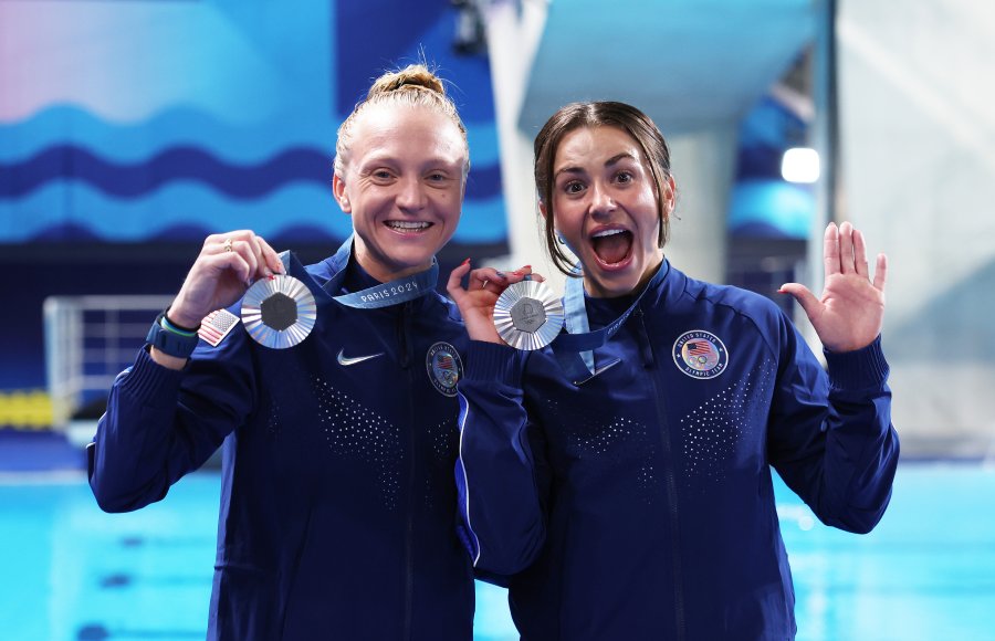 Sarah Bacon and Kassidy Cook pose with their medals