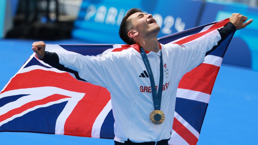 Great Britain's Alex Yee after winning the gold medal in men's triathlon.