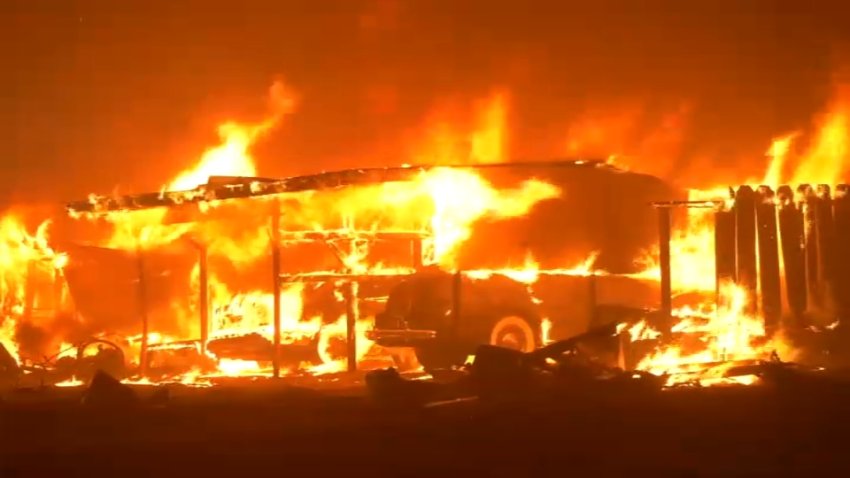 A structure burns in the Park Fire in Butte County early Thursday. (July 25, 2024)