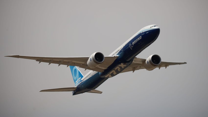 A Boeing 777x aircraft during an aerial display on the opening day of the Farnborough International Airshow in Farnborough, UK, on Monday, July 18, 2022.