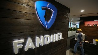 A sign hangs on the wall in the reception area at Fanduel Inc.’s offices in Edinburgh, U.K., on Tuesday, Feb. 7, 2017.