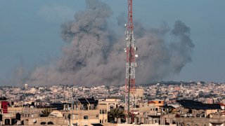 A picture taken from Rafah shows smoke billowing over Khan Yunis in the southern Gaza Strip during Israeli bombardment on March 4, 2024, amid ongoing battles between Israel and the Palestinian militant group Hamas. 