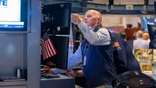 Traders work on the floor of the New York Stock Exchange (NYSE) on July 24, 2024 in New York City.