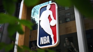 The NBA logo is seen outside an NBA fan store in New York on July 8, 2024. 