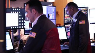 Traders work on the floor of the New York Stock Exchange during afternoon trading on August 02, 2024 in New York City. 