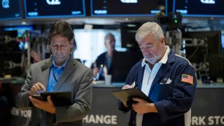 Traders work the floor of the New York Stock Exchange on August 16, 2024.