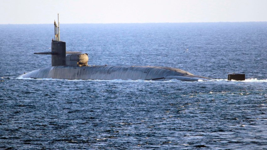 In this photo made available by the U.S. Navy, the guided-missile submarine USS Georgia transits the Strait of Hormuz in Persian Gulf, Monday, Dec. 21, 2020. The USS Georgia traversed the strategically vital waterway between Iran and the Arabian Peninsula on Monday, the U.S. Navy said, a rare announcement that comes amid rising tensions with Iran.