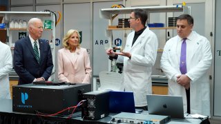 President Joe Biden and first lady Jill Biden listen during a demonstration of cancer research and detection techniques at Tulane University, Tuesday, Aug. 13, 2024, in New Orleans. 