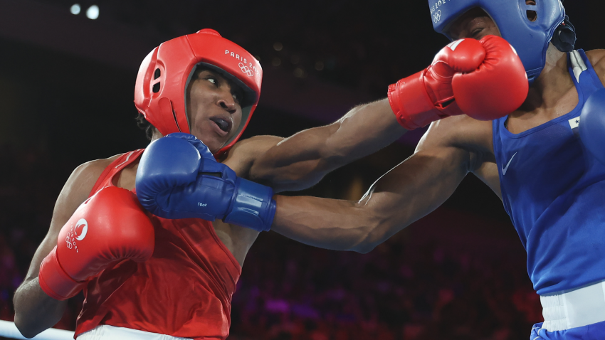 Boxer Cindy Ngamba wins first medal for Olympic Refugee Team