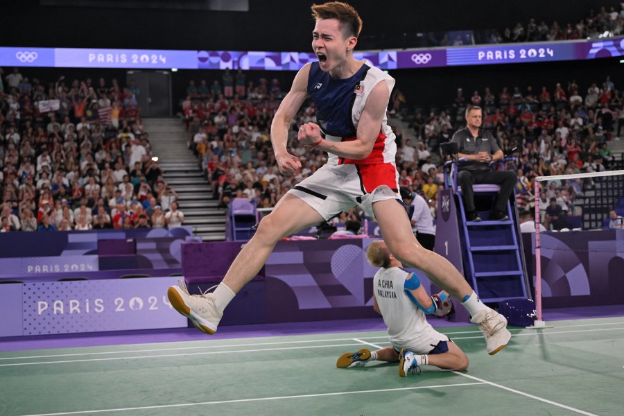 Malaysia's Soh Wooi Yik celebrates winning the men's doubles badminton quarter-final match