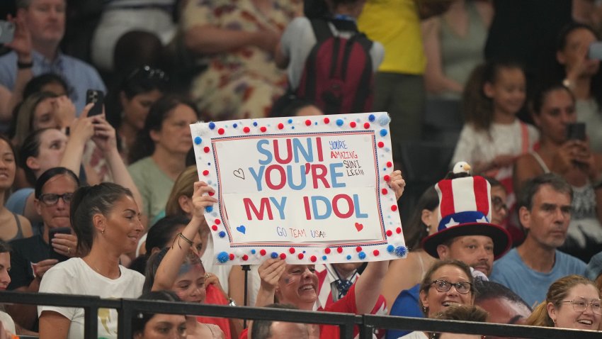 A fan of Team USA Sunisa Lee holds a sign during the Women's team competition final at Bercy Arena in Paris, France.