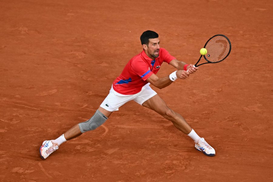 Novak Djokovic returns a ball