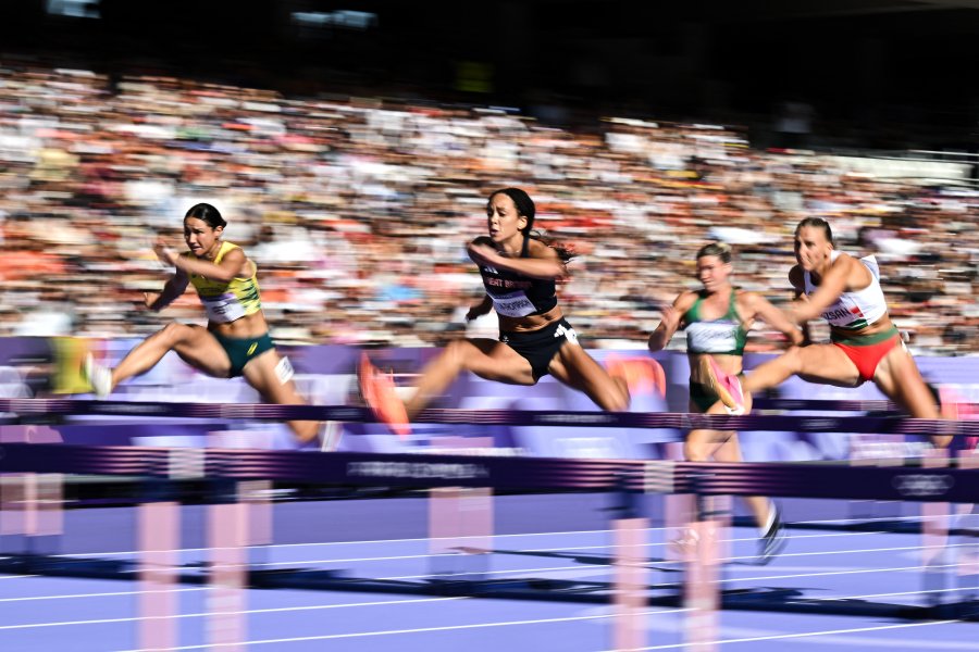 Britain's Katarina Johnson-Thompson competes in the women's heptathlon 100m hurdles of the athletics event at the Paris 2024 Olympic Games at Stade de France in Saint-Denis, north of Paris, on August 8, 2024