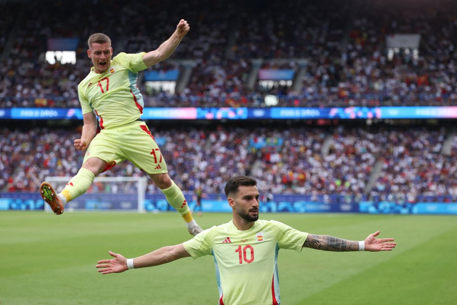 Spain's midfielder #10 Alex Baena celebrates with Spain's defender #17 Sergio Gomez