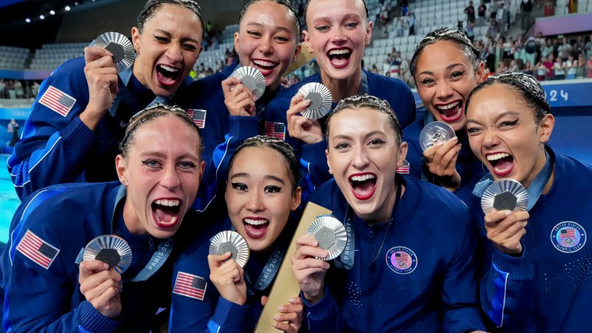 Aug 7, 2024; Paris, France; Team USA celebrates their silver medal during the Paris 2024 Olympic Summer Games at Aquatics Centre. Mandatory Credit: Grace Hollars-USA TODAY Sports