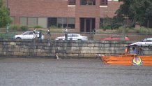 A man and his toddler in the Charles River as they were being rescued by a duck boat on Monday, Aug. 19, 2024.