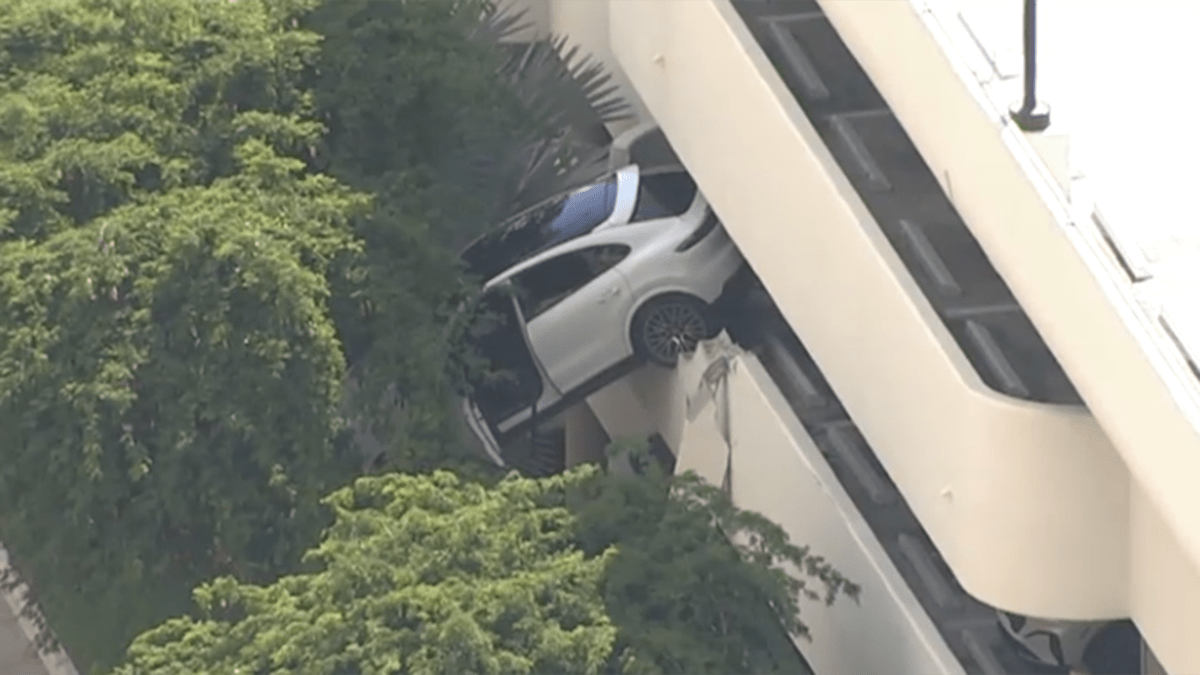 Porsche SUV left dangling from parking garage in Coral Gables NBC Bay