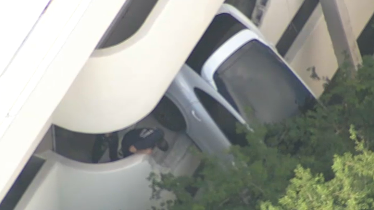 Porsche SUV left dangling from parking garage in Coral Gables NBC Bay
