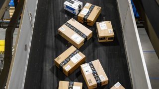 Packages move along a conveyor belt at an Amazon Fulfillment center on Cyber Monday in Robbinsville, New Jersey, on Nov. 28, 2022.