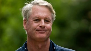 John Donahoe, chief executive officer of eBay Inc., leaves a morning session during the Allen & Co. Media and Technology Conference in Sun Valley, Idaho.