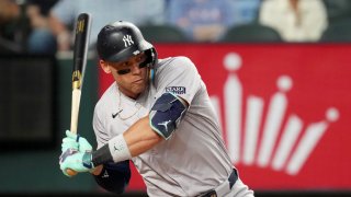 Aaron Judge #99 of the New York Yankees swings his bat during the first inning against the Texas Rangers at Globe Life Field on September 03, 2024 in Arlington, Texas.