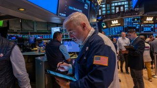 Traders work on the New York Stock Exchange (NYSE) floor on September 13, 2024, in New York City.