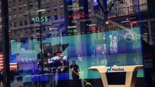 A worker sweeps the floor at the Nasdaq MarketSite in New York, US, on Monday, Sept. 16, 2024. 