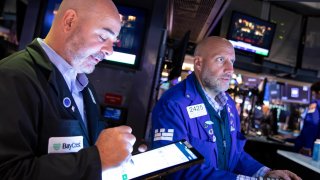 Traders work on the floor of the NYSE. 