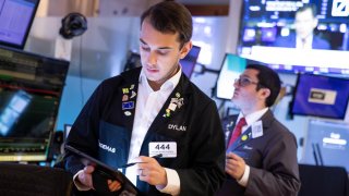 Traders work on the floor of the NYSE. 