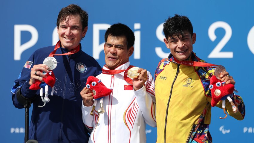 Silver medalist, Dennis Connors of Team USA, gold medalist, Jianxin Chen of Team China and bronze medalist, Juan Jose Betancourt Quiroga, pose for a photo