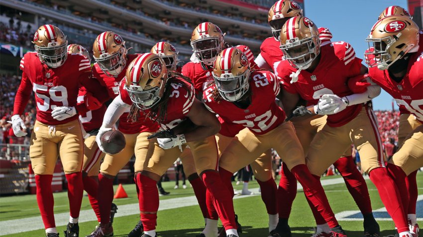 San Francisco 49ers' Fred Warner and teammates.