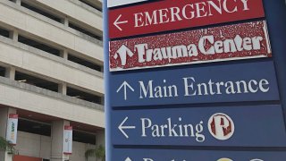 FILE - A sign is displayed outside a hospital in Miami, on July 9, 2020.