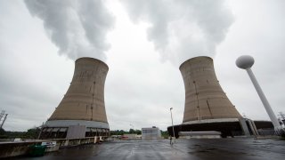 FILE – This May 22, 2017 file photo, shows cooling towers at the Three Mile Island nuclear power plant in Middletown, Pa.