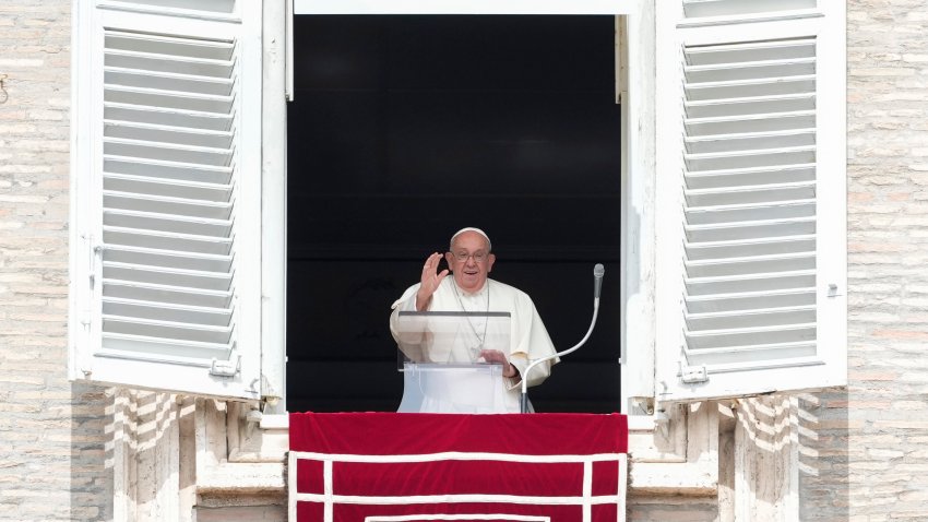 Pope Francis waves during the Angelus noon prayer from the window of his studio overlooking St.Peter’s Square, at the Vatican, Sunday, Sept. 22, 2024.