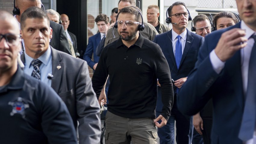 Ukrainian President Volodymyr Zelenskyy, center, tours the Scranton Army Ammunition Plant