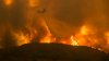 Wildfires in Southern California torch dozens of homes and force thousands to evacuate