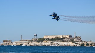 Blue Angels planes fly near Alcatraz Island.